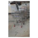 4 metal grocery carts (outside)