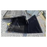 Large black HVAC/radiator-style panels or filters,