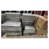 Large quantity of stainless steel food-service pan