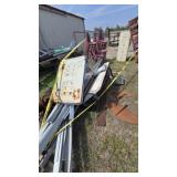 Assorted blue and yellow metal pipe, posts, rails