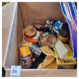 Box of shoe polish, brushes and rags