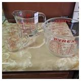 Three glass measuring cups
