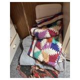 Stack of assorted blankets