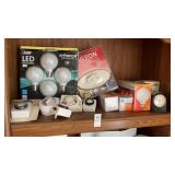 Shelf Lot of Light Bulbs and Timers