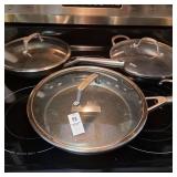 There ninja skillets with lids