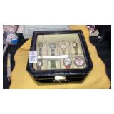 8 wristwatches in display storage case