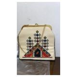 Cross-stitched evening bag with chain