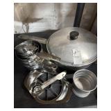 Measuring cups, apple slicer, egg poacher and