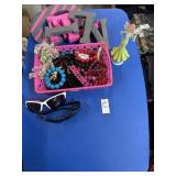 Sunglasses, beads, wooden letters