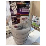 Waste can, space bags, and shower curtain hooks