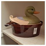 Ceramic bean pot with a duck-shaped lid.