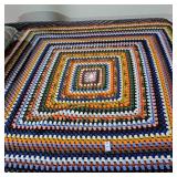 handmade, multicolored crochet blanket with a