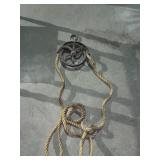 Vintage cast pulley with rope Vintage cast pulley with rope