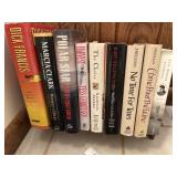 9 Novels on book rack