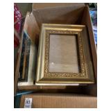 Box of picture frames and binders