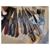 Assortment of knives and cutting board