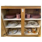 Pink stoneware plates and mugs, various pieces of