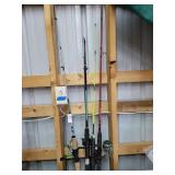4 fishing poles and reels