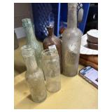 Clorox, Mouquin, and other glass bottles