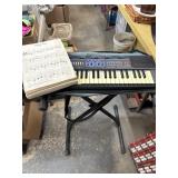 Keyboard, stand, and music