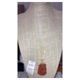 Sterling silver carved orange jade pendant