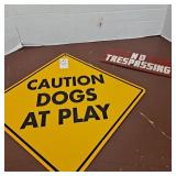 Caution dogs at play,no trespassing sign