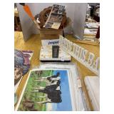 Bathroom scale, plastic cow and courier and Ives