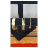 Gold bangle and hinged bracelets