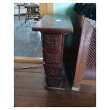 Repurposed sewing machine cabinet drawer stand