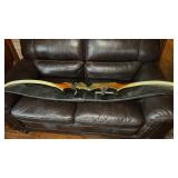 Fred Bear recurve bow with a sight and