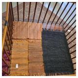 3 handmade woven place mats, black rug