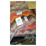 Chevron Blanket with orange, brown, tan, and