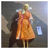 Vintage Barbie doll with orange house robe