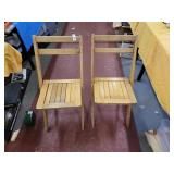 2 wooden folding chairs