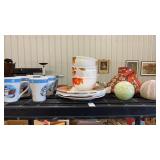 Shelf of Christmas Mugs, Autumn Plates, and Decor