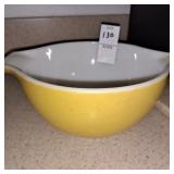Vintage yellow Pyrex Cinderella mixing bowl.