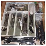 Drawer of assorted flatware, knives
