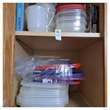 Cabinet with various plastic storage containers