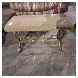 Gold-toned metal accent or vanity stool with a