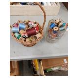 Lot of thread in mug and basket