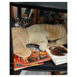 Shelf lot with antique stuffed dog and books