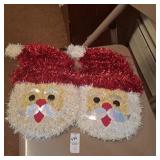 Two tinsel Santa Claus Christmas wall