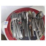 Assorted flatware with decorative tray