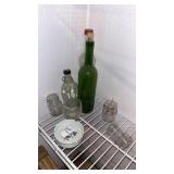 Assortment of Glass Bottles and Ash Tray