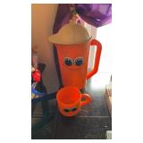 Orange Deka Footsie Tootsie plastic pitcher and