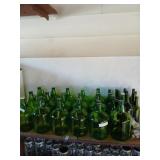 Shelf lot of clean wine making bottles, corks