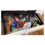 Drawer of Measuring Cups, Grater, and Kitchen