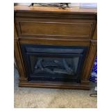 Propane fireplace. Wooden. 42ï¿½ï¿½ wide  by 15ï¿½ï¿½