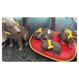 Ceramic dog and puppies on dog bed