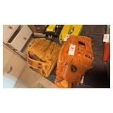 Two Baseball Gloves Mag and Rawlings